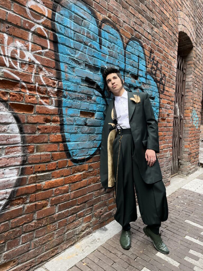 wearing a zoot suit against a brick wall 