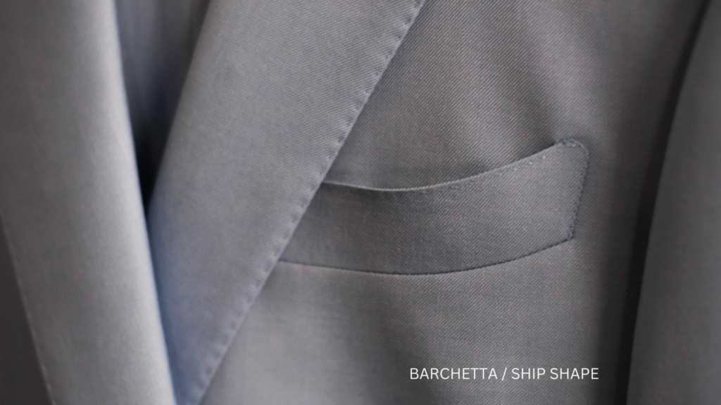 blue suit with text reading barchetta/ship shape pocket